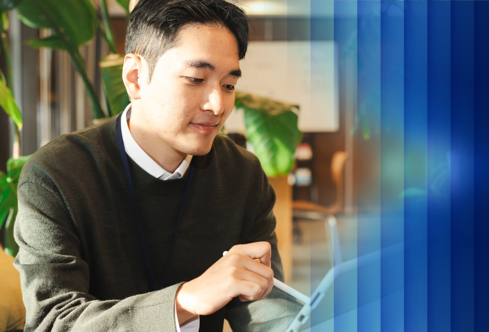 Man in wheelchair using a tablet device