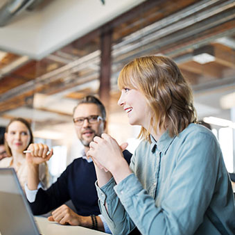 Employees sitting at a table having a discussion