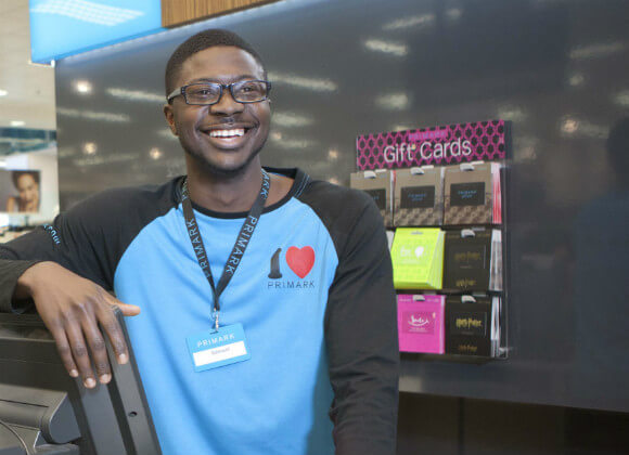 Sam working in a Primark store