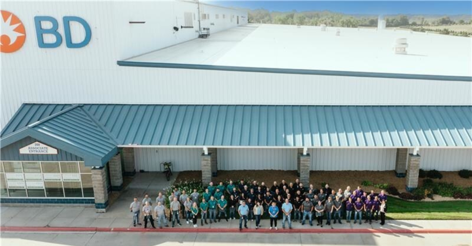 BD associates gathered outside a BD manufacturing facility.