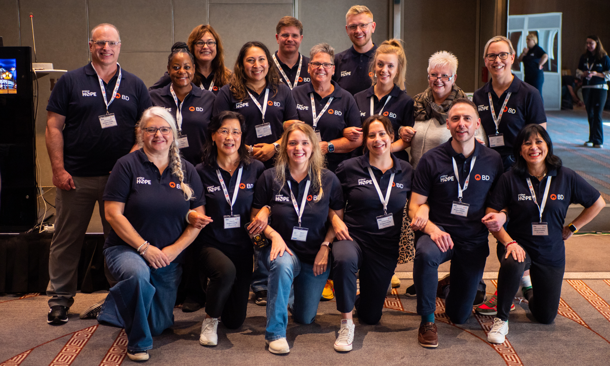 Group of BD associates wearing navy shirts at Volunteer Service Trip