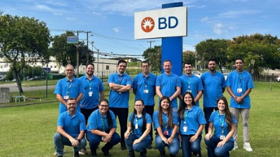BD associates posing together outdoors at a site location