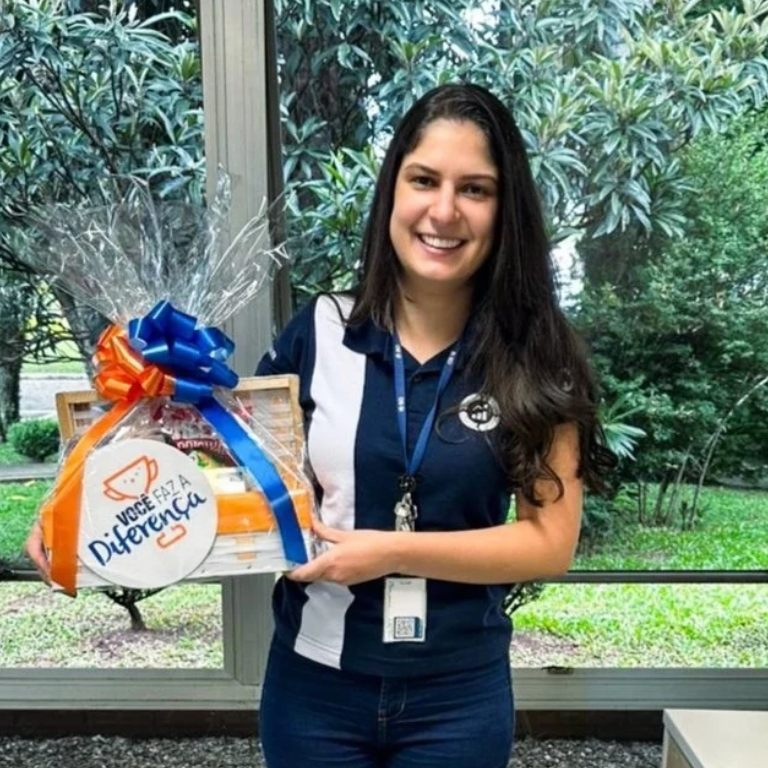 BD associate holding an employee recognition award