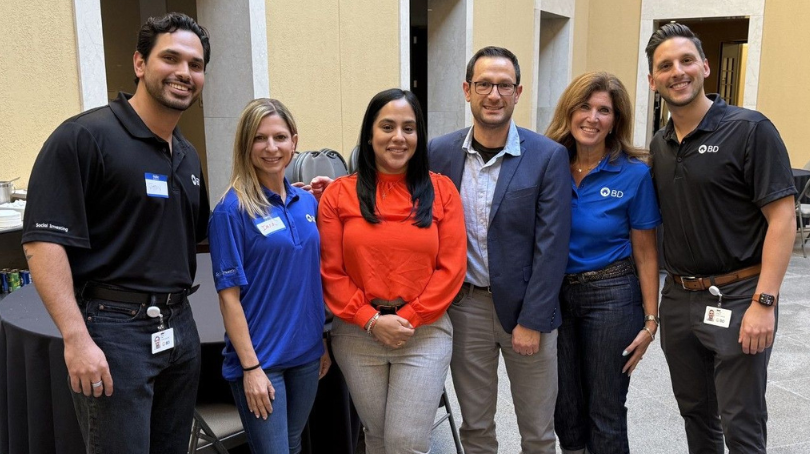 BD associates and local non-profit partners posing together in large atrium during the Difference in a Day Marathon at Franklin Lakes, New Jersey.