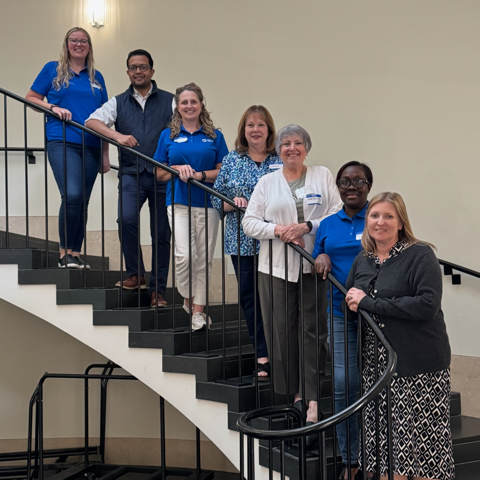 BD associates and local non-profit partners gathered on a staircase during the Difference in a Day Marathon at Franklin Lakes, New Jersey.