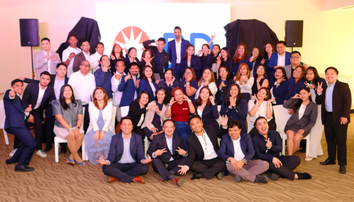 Large group of BD associates in the Philippines posing together at a company event.
