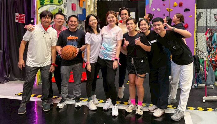 BD associates participating in a team-building activity at an indoor sports centre.