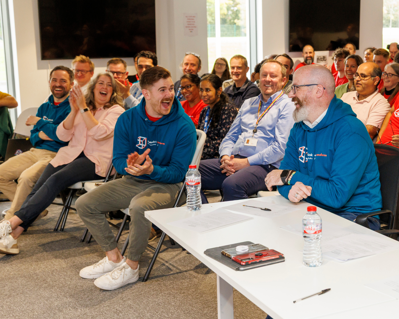 Large group of BD associates laughing at a BD event