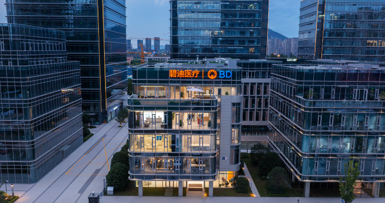 Building in a city with BD logo on the top