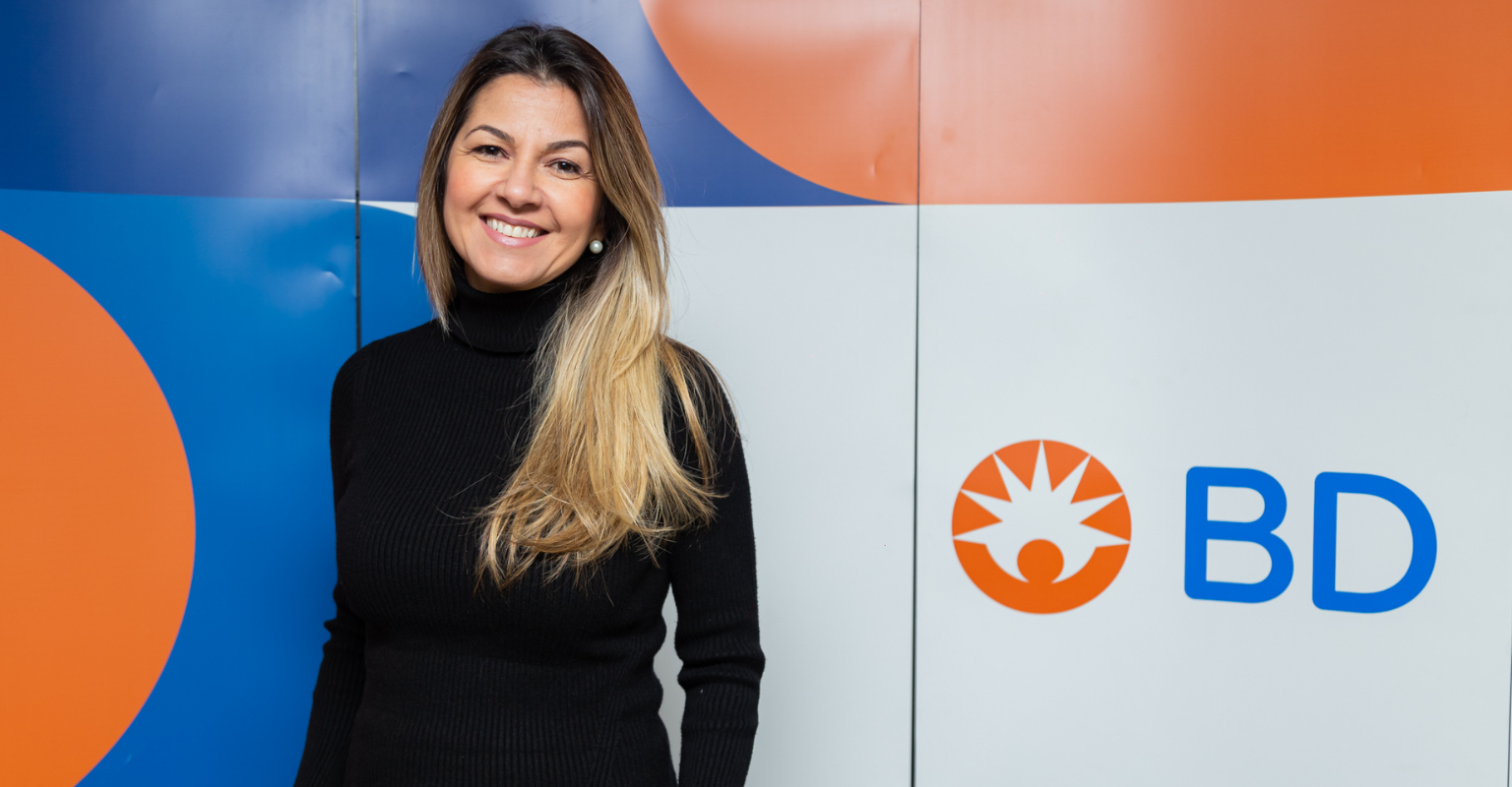 BD associate standing in front of a BD branded wall.