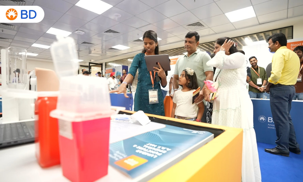 Associates welcome visitors during a BD India community event, showcasing healthcare innovation and STEM education experiences.