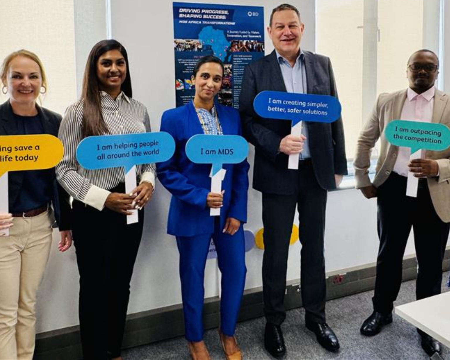 BD associates holding branded message signs during an internal event