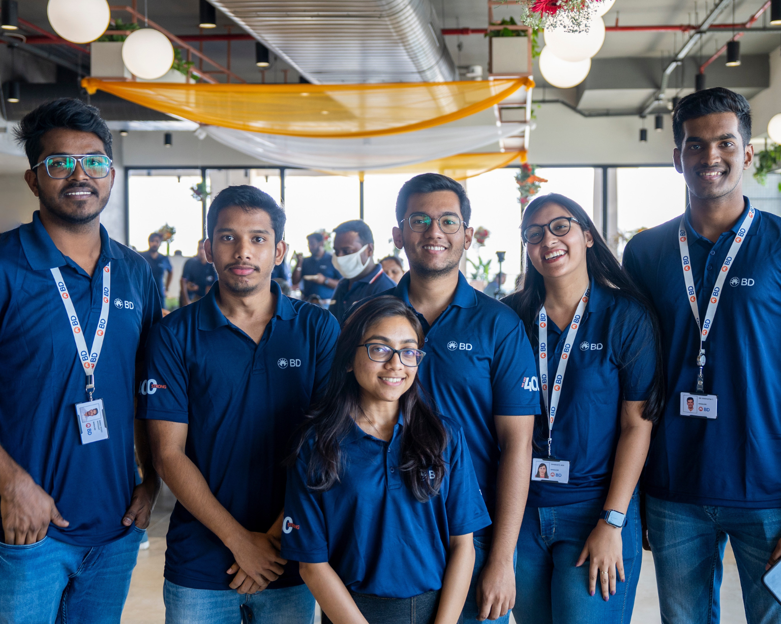 Group of BD associates standing together in a BD office