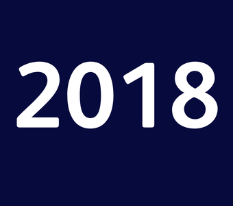 The year &ldquo;2018&rdquo; displayed in white text on a dark blue background.