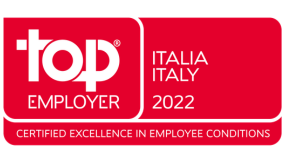 Red Top Employer certification badge displaying &ldquo;Top Employer Italia 2022&rdquo; with the tagline &ldquo;Certified Excellence in Employee Conditions&rdquo;