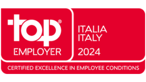 Red Top Employer certification badge displaying &ldquo;Top Employer Italia 2024&rdquo; with the tagline &ldquo;Certified Excellence in Employee Conditions&rdquo;