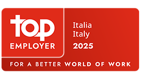 Red Top Employer certification badge displaying &ldquo;Top Employer Italia 2025&rdquo; with the tagline &ldquo;For a Better World of Work.&rdquo;