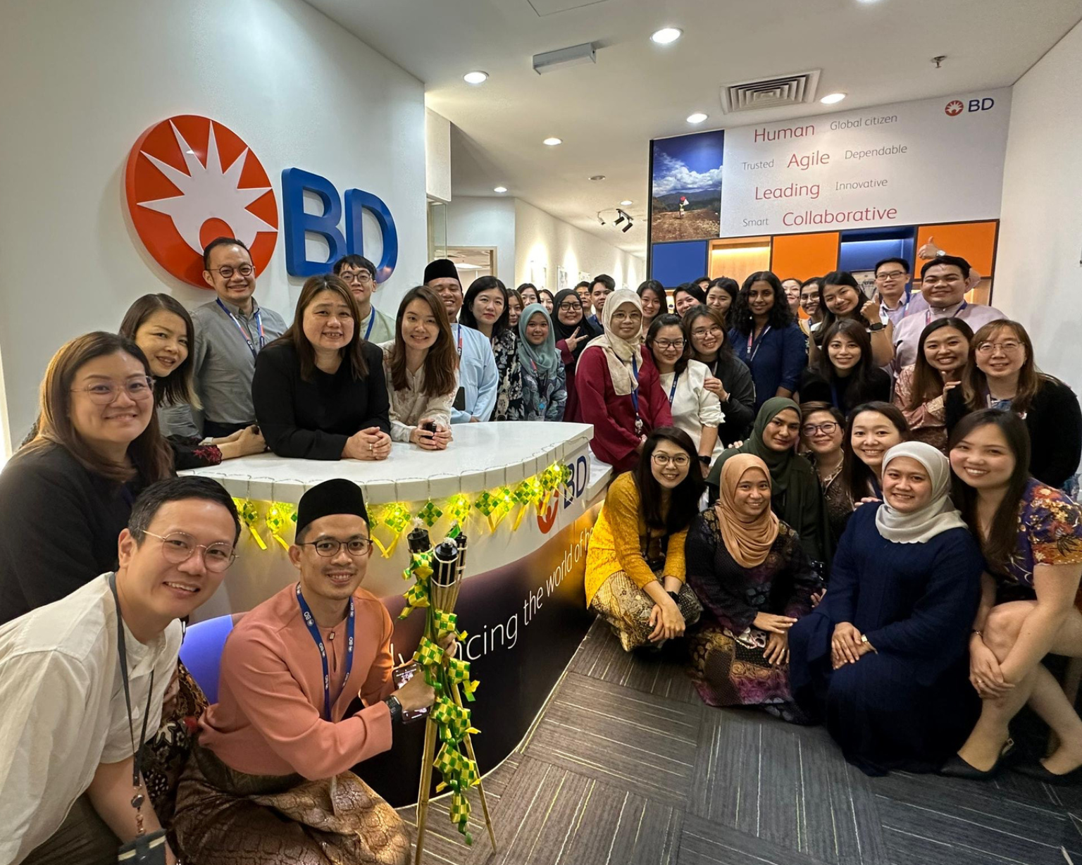 BD associates gathered around a reception desk inside a BD office