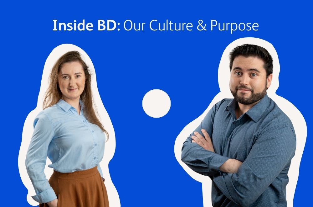 Graphic featuring two individuals standing in front of a dark blue background with the text ‘Inside BD: Our Culture and Purpose. Each person is outlined with a white border and wearing business attire.