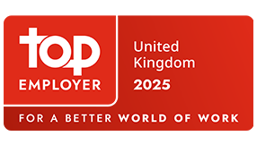 Red Top Employer certification badge displaying &ldquo;Top Employer United Kingdom 2025&rdquo; with the tagline &ldquo;For a Better World of Work.&rdquo;