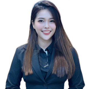 Portrait-style photo of an individual with long, dark hair wearing a black suit.