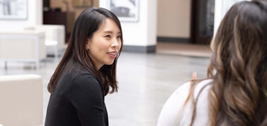 Woman having a conversation with another woman