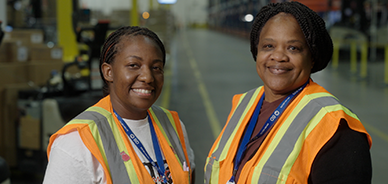 Two african-american women at manufacturing plant