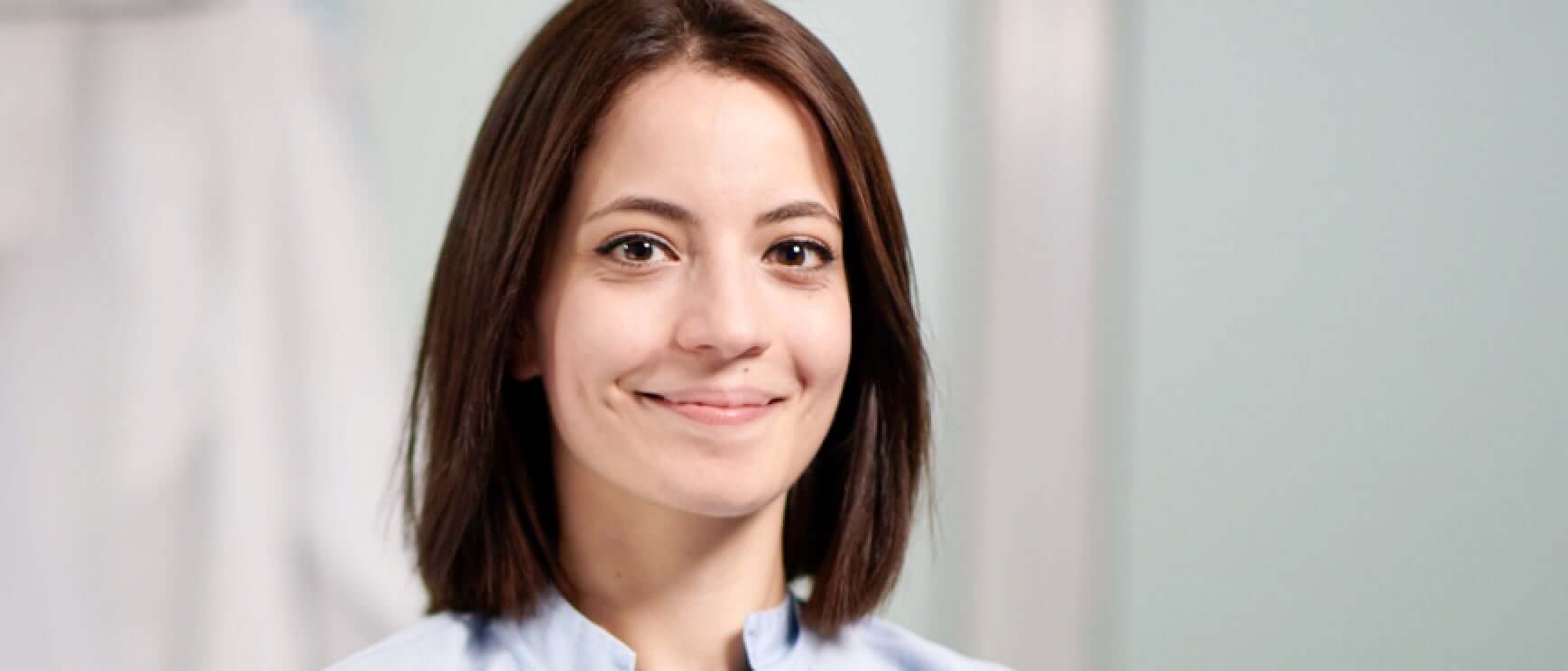 Headshot of an employee smiling