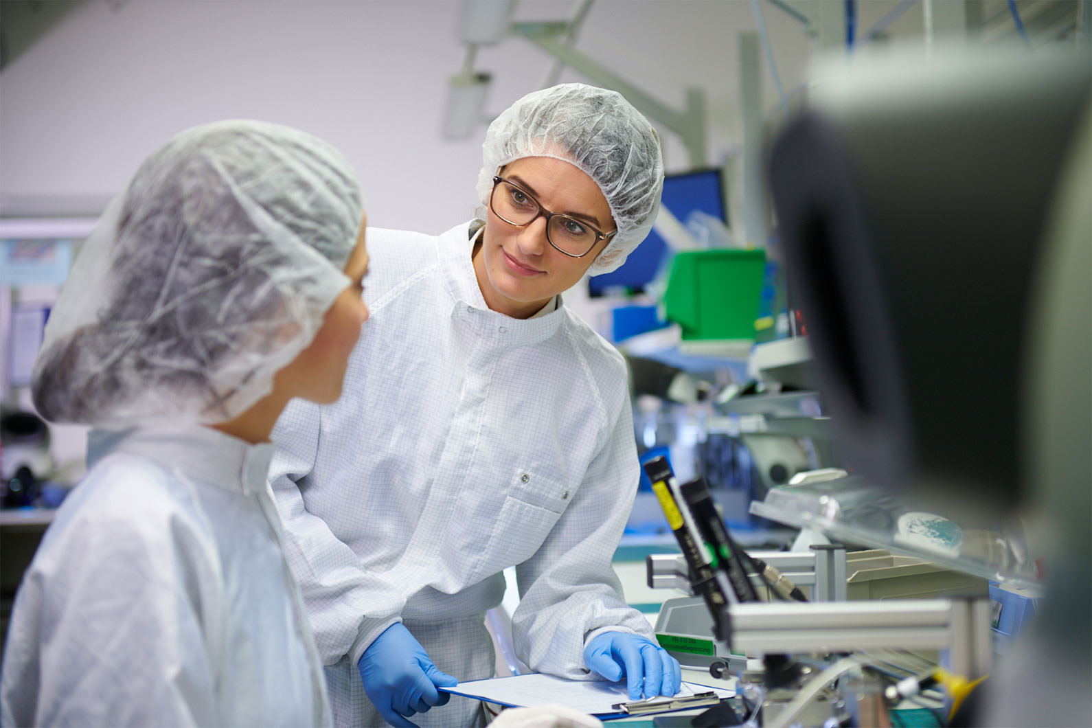 Two doctors talking in lab