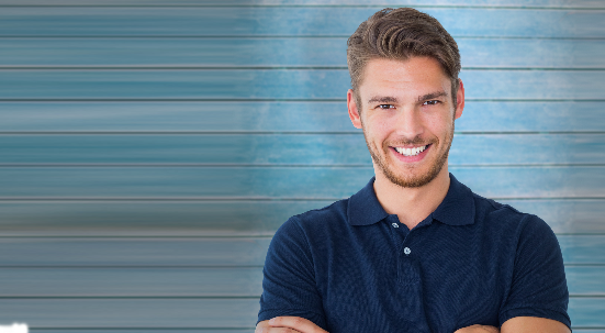 Man smiling wearing dark blue polo shirt