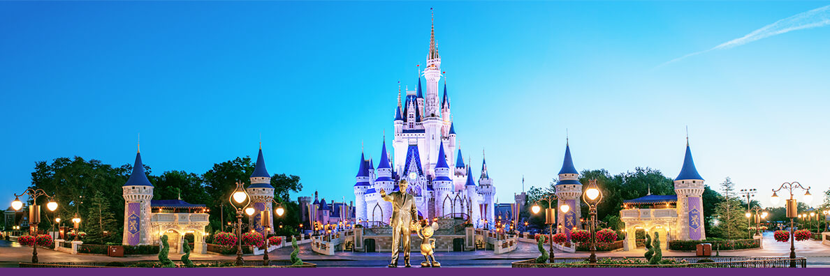 Walt Disney and Mickey Mouse Statues in front of Cinderella Castle