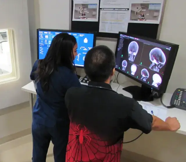 employees at compute looking at xrays