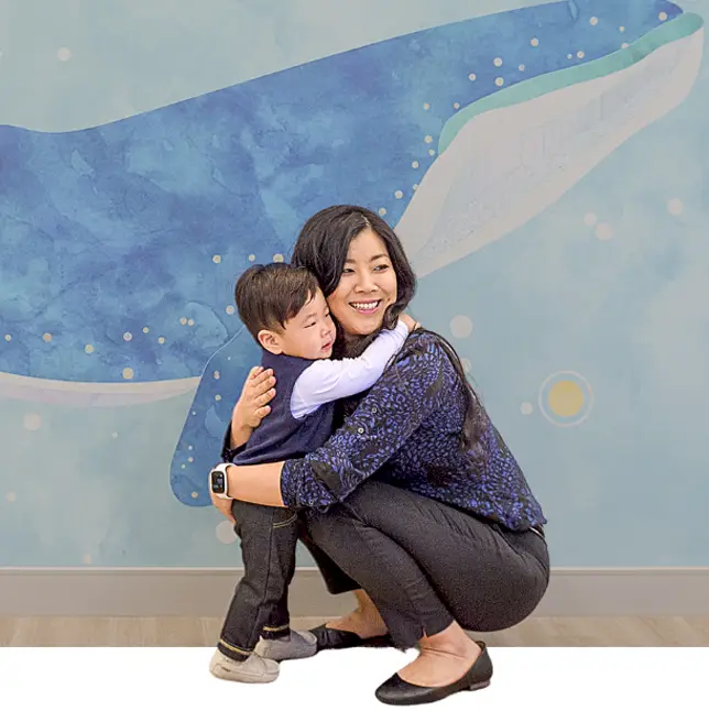 nurse holding a child