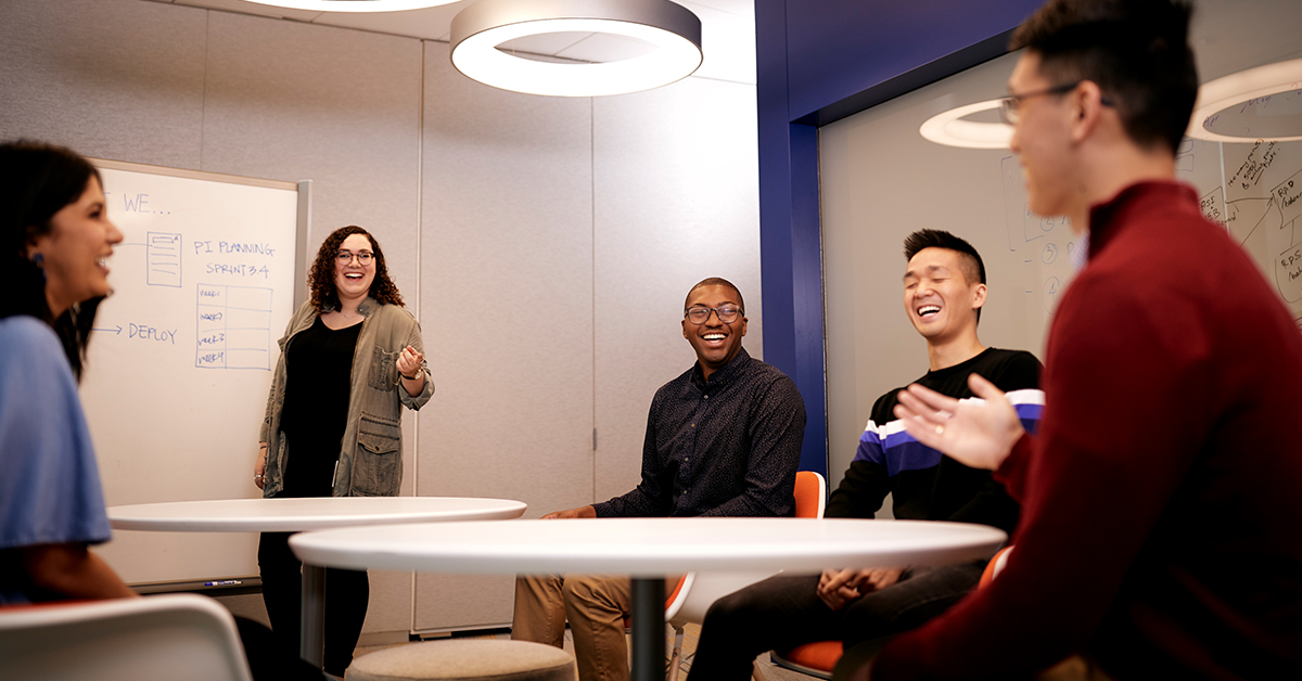 Capital One student and grad associates collaborate in a meeting room