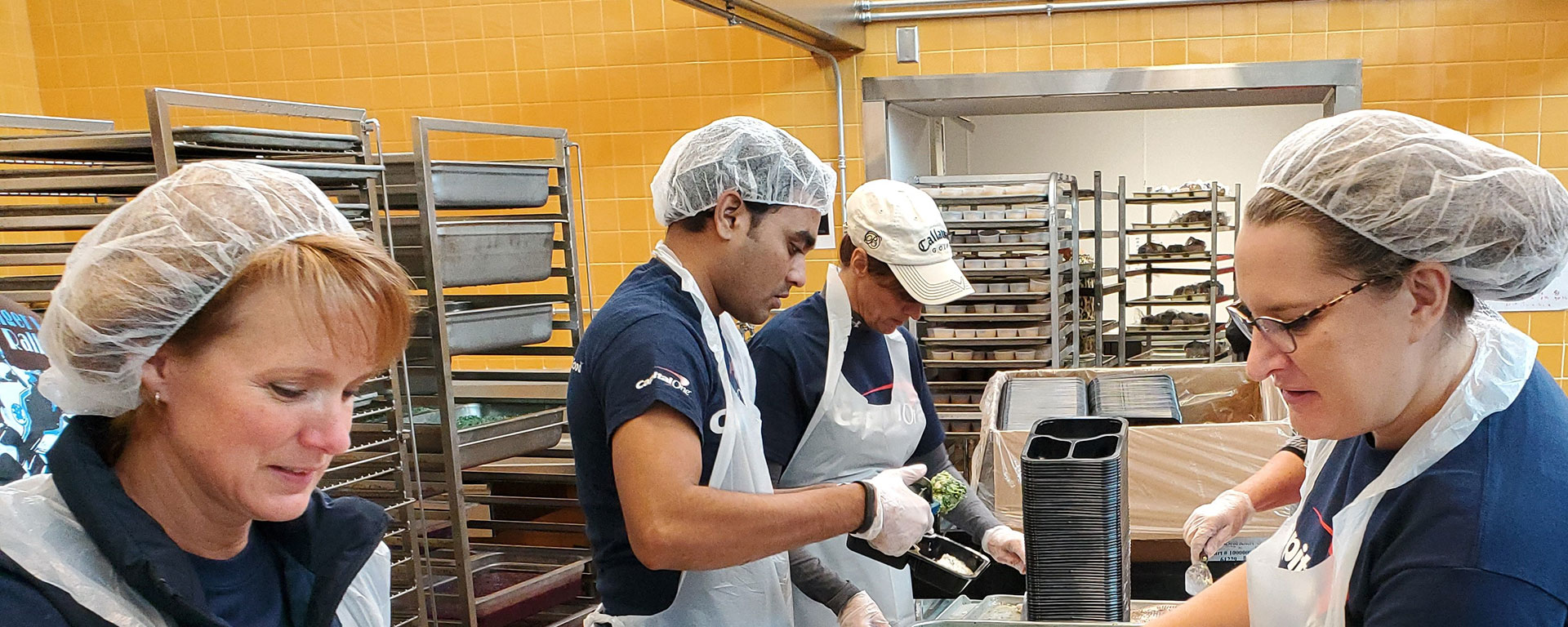 Capital One associates volunteer in their community at Feed More, a local Richmond-area food bank