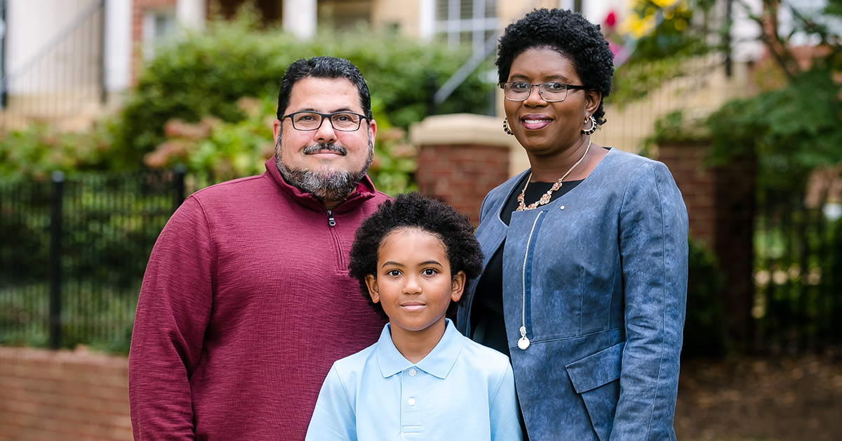 Capital One HR Tech leader Maureen Jules-Perez stands outside with her family and shares her thoughts on Diversity