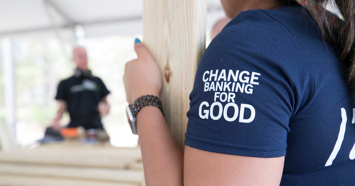 Capital One associate volunteering and wearing a Change Banking for Good shirt