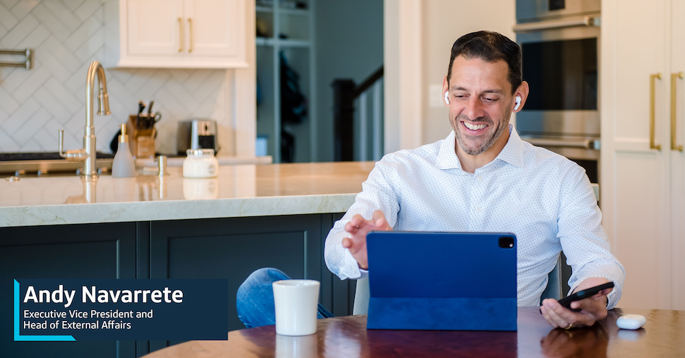 Andy Navarrete, Capital One Executive Vice President and Head of External Affairs, sits in his kitchen with his iPad