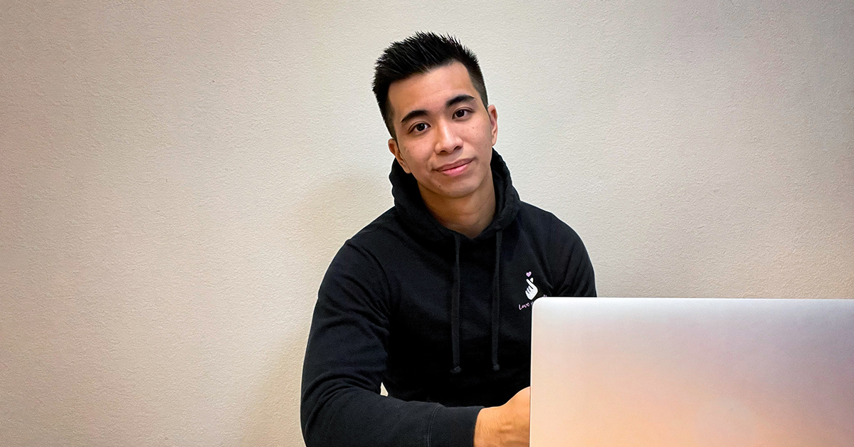 Joshua, Capital One intern, sits at his laptop