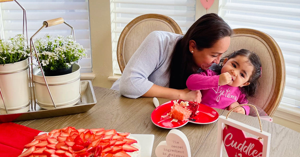 Linda enjoys a piece of cake with her daughter.