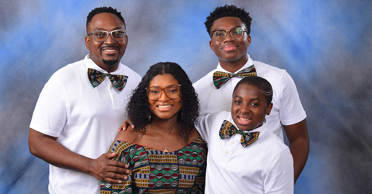 A family photo of Capital One associate Lenton and his wife and two sons