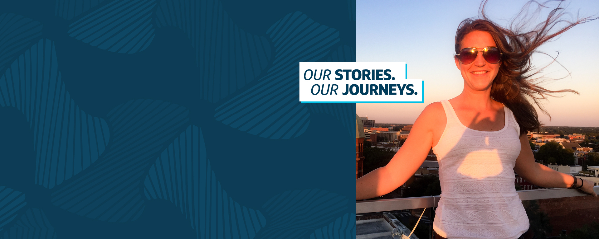 A picture of Myra, Capital One associate, standing outside with the wind blowing her hair and sunglasses on, next to a Capital One blue patterned background with the words, "Our Stories, Our Journeys"