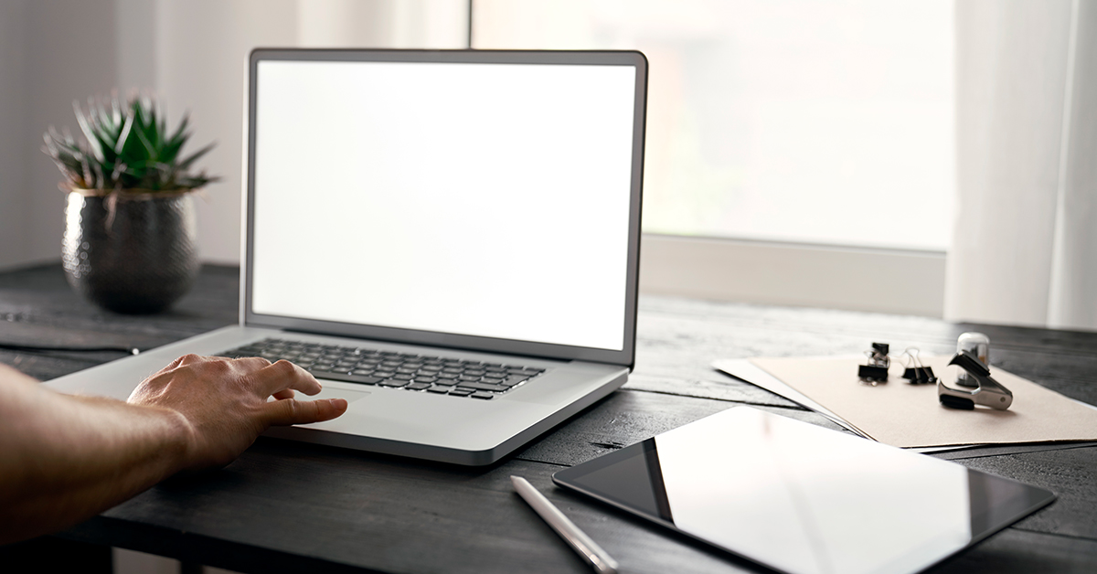 Capital One laptop being used on table to work from home