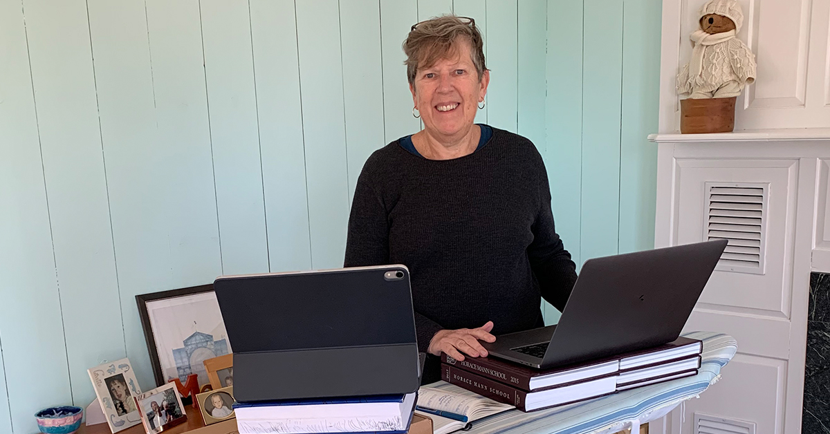 Capital One tech leader Diane stands at her computer and talks about women in leadership