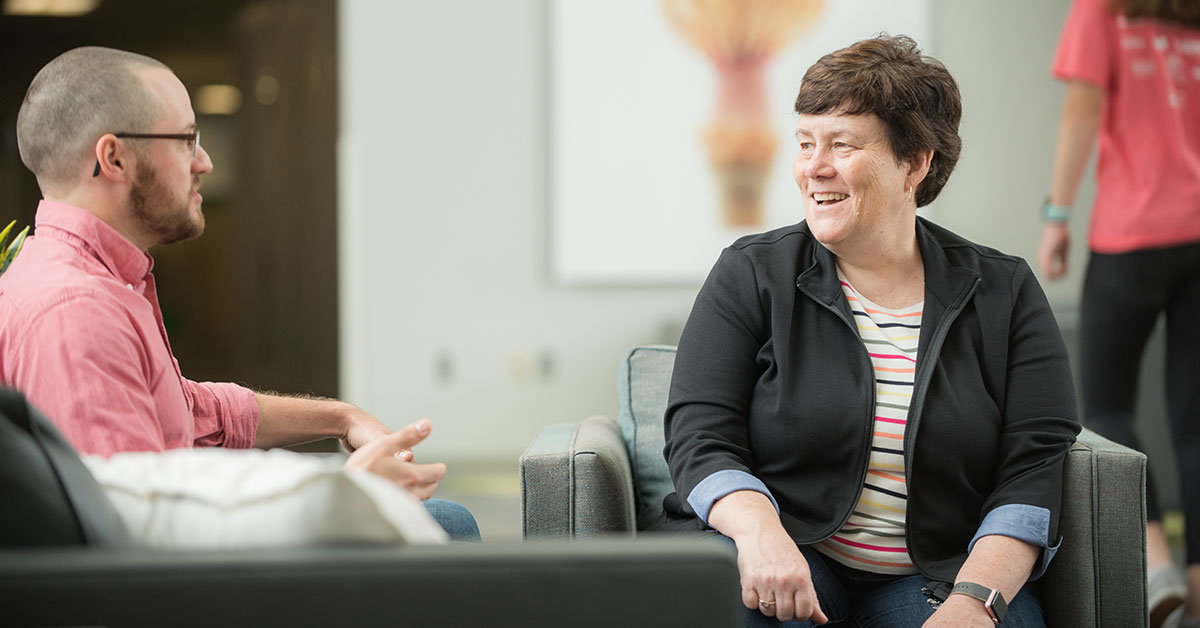 woman explaining diversity of thought to a team member