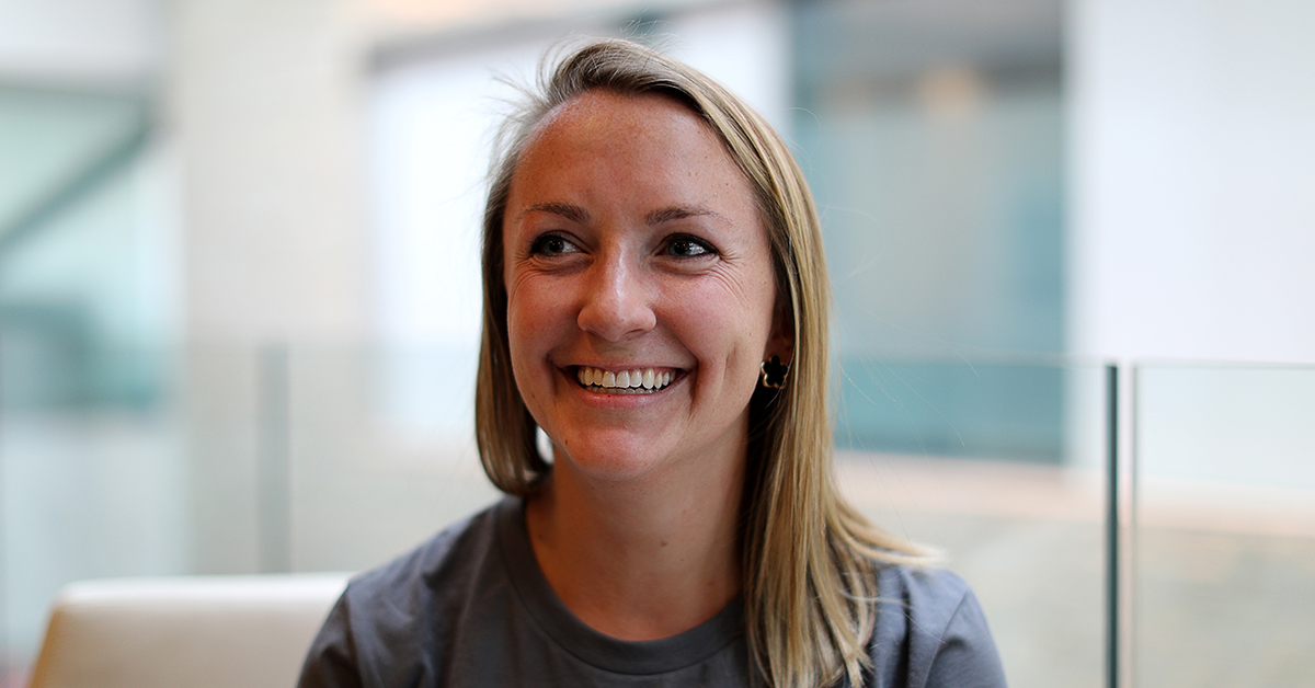 Close up of shannon smiling in Finvest shirt