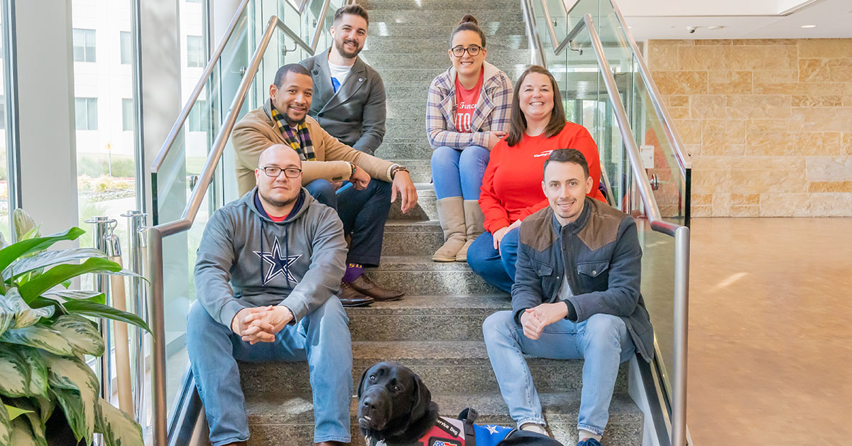 Capital One partnering with Patriot PAWS, a non-profit organization, to raise a service dog in training in an office setting at Capital One