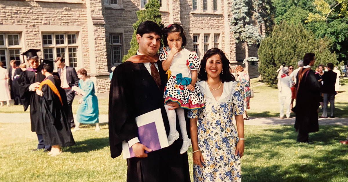 Sanjib Yajnik, president of Capital One's Financial Services, stands with his family at hs graduation as he begins his career