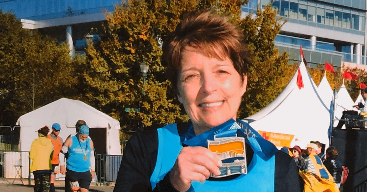 denise showing her medal after the race