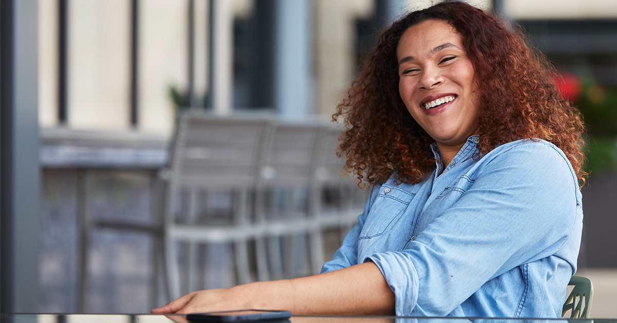 Tia, a Capital One Tech associate, sits outside and talks about her day in the life at Capital One